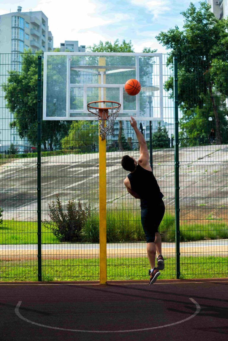 sportsman-scoring-goal-basketball-hoop (1)